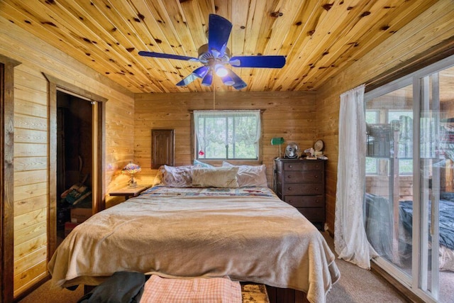 30901 Sunny Beach Rd, Grand Rapids, MN 55744 - bedroom with wooden walls, carpet floors, wood ceiling, and a ceiling fan