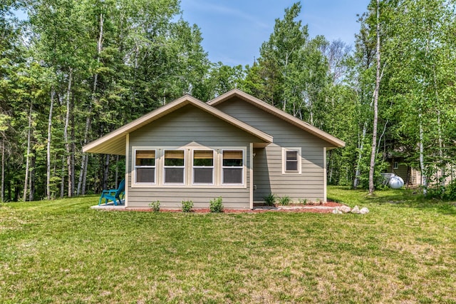 15989 Lost Oaks Dr SE, Cass Lake, MN 56633 - view of front of house with a front lawn