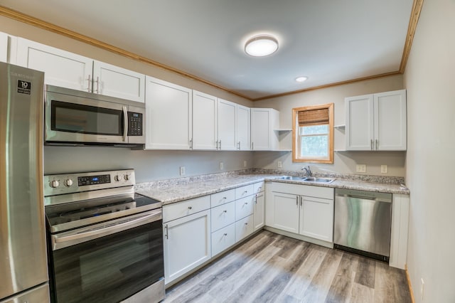 15989 Lost Oaks Dr SE, Cass Lake, MN 56633 - kitchen featuring stainless steel appliances, a sink, open shelves, crown molding, and white cabinetry