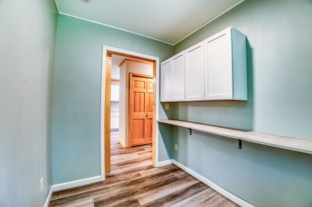 15989 Lost Oaks Dr SE, Cass Lake, MN 56633 - corridor with wood finished floors, baseboards, and crown molding