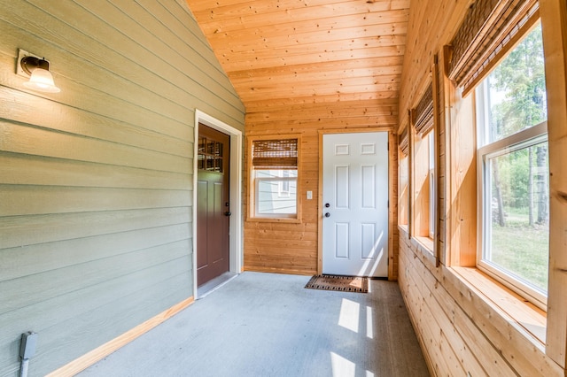15989 Lost Oaks Dr SE, Cass Lake, MN 56633 - unfurnished sunroom featuring vaulted ceiling and healthy amount of natural light