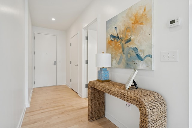 3104 Lake St Unit 412, Minneapolis, MN 55416 - hall with light wood finished floors, recessed lighting, and baseboards