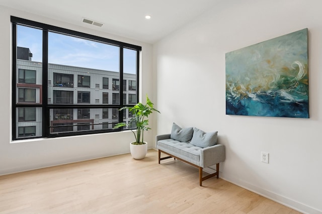 3104 Lake St Unit 412, Minneapolis, MN 55416 - living area with wood finished floors, baseboards, and recessed lighting