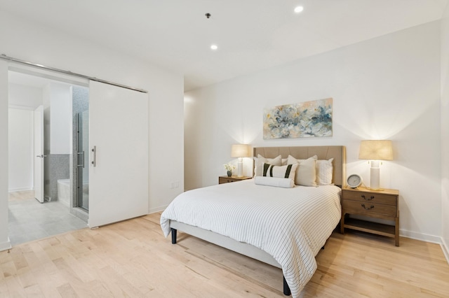 3104 Lake St Unit 412, Minneapolis, MN 55416 - bedroom with light wood-style flooring, recessed lighting, and baseboards