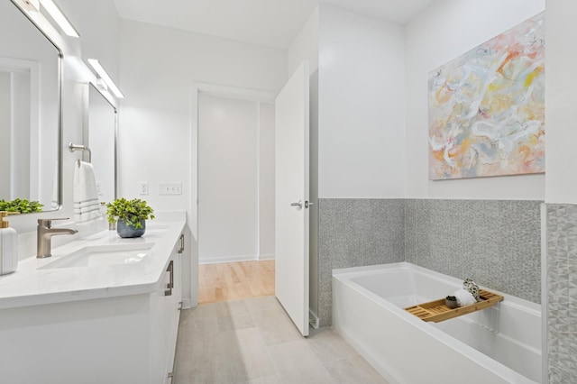 3104 Lake St Unit 412, Minneapolis, MN 55416 - bathroom featuring double vanity and a bath