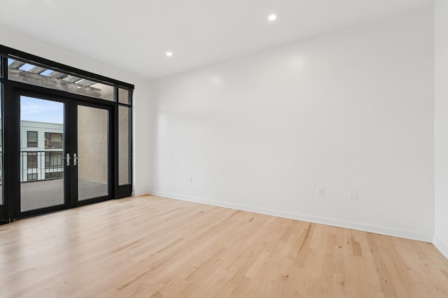 3104 Lake St Unit 412, Minneapolis, MN 55416 - empty room featuring wood finished floors, french doors, baseboards, and recessed lighting