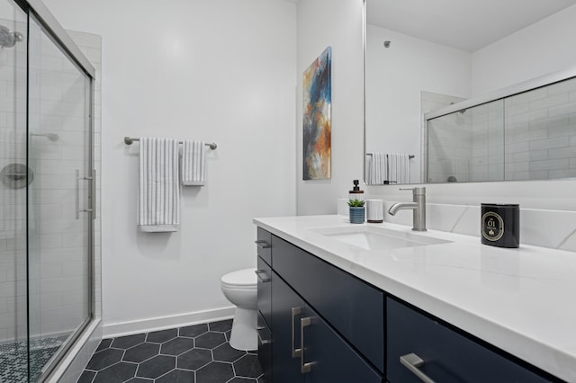 3104 Lake St Unit 412, Minneapolis, MN 55416 - full bath featuring vanity, toilet, baseboards, tile patterned floors, and a shower stall