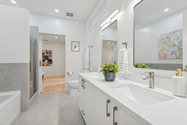3104 Lake St Unit 412, Minneapolis, MN 55416 - full bathroom with double vanity, a bath, recessed lighting, and a shower stall