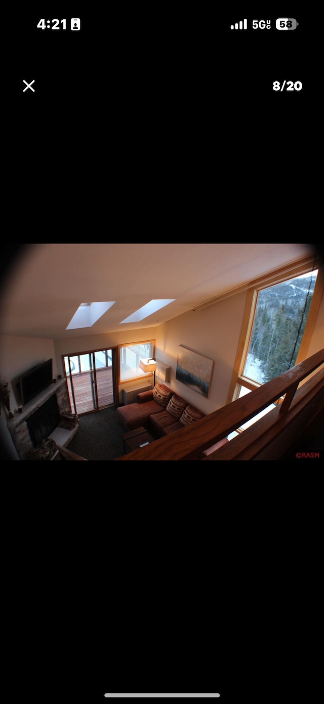 122 Bridge Run Ln Unit A, Lutsen Twp, MN 55615 - stairs featuring a skylight and carpet flooring