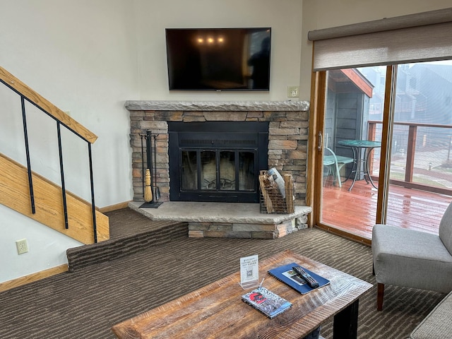 122 Bridge Run Ln Unit A, Lutsen Twp, MN 55615 - living room featuring carpet flooring, a fireplace, baseboards, and stairway