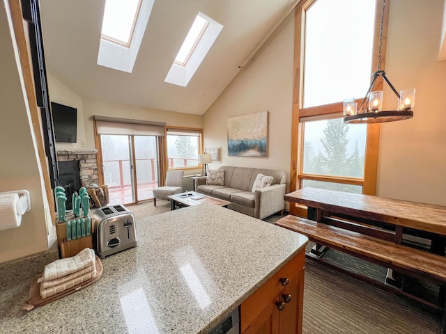 122 Bridge Run Ln Unit A, Lutsen Twp, MN 55615 - living room with a skylight, high vaulted ceiling, and a chandelier
