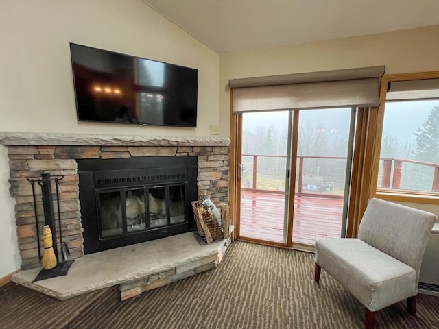 122 Bridge Run Ln Unit A, Lutsen Twp, MN 55615 - carpeted living area featuring vaulted ceiling and a fireplace