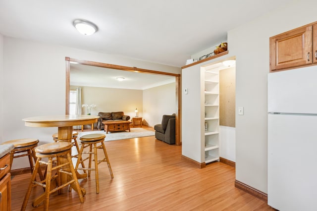 348 6th Ave S, Saint Cloud, MN 56301 - dining space featuring light wood finished floors and baseboards