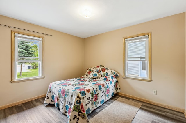 348 6th Ave S, Saint Cloud, MN 56301 - bedroom with wood finished floors and baseboards