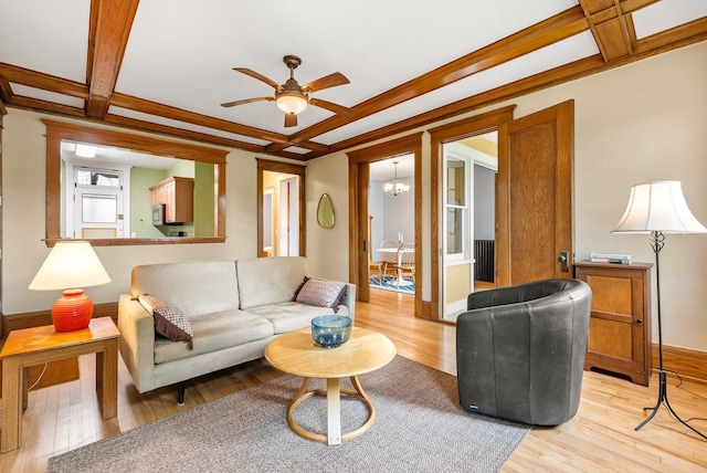1112 25th St Unit 203, Minneapolis, MN 55405 - living area featuring light wood finished floors, a ceiling fan, baseboards, coffered ceiling, and a chandelier