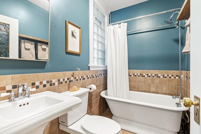 1112 25th St Unit 203, Minneapolis, MN 55405 - bathroom with tile walls, a sink, toilet, and wainscoting