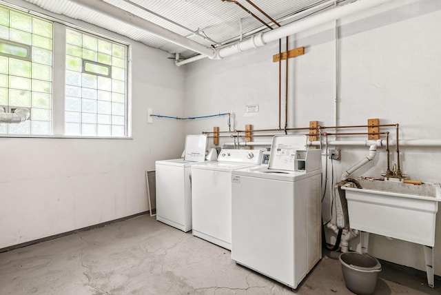 1112 25th St Unit 203, Minneapolis, MN 55405 - laundry room featuring washer and dryer and a sink
