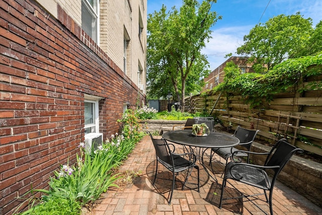 1112 25th St Unit 203, Minneapolis, MN 55405 - fenced backyard featuring a patio area and outdoor dining area