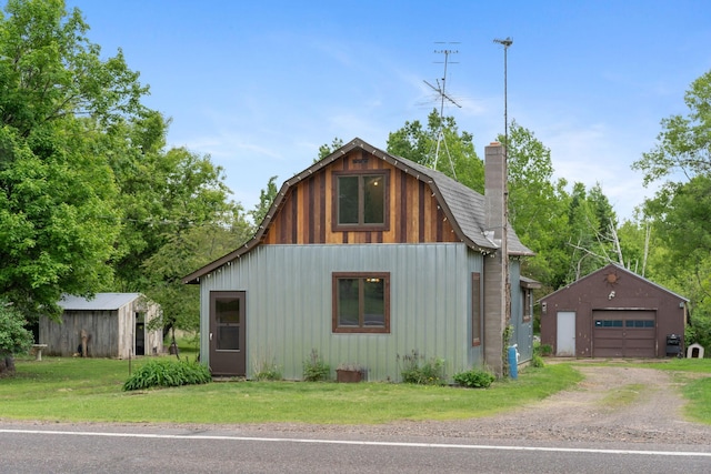 7627 Main St, Danbury, WI 54830 - view of outdoor structure featuring dirt driveway