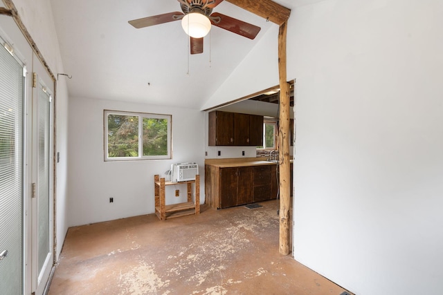 7627 Main St, Danbury, WI 54830 - kitchen featuring lofted ceiling, dark brown cabinetry, ceiling fan, and a wall mounted AC
