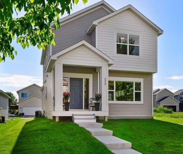 2908 Mark Twain Dr, Chaska, MN 55318 - view of front of home with a front yard and a detached garage