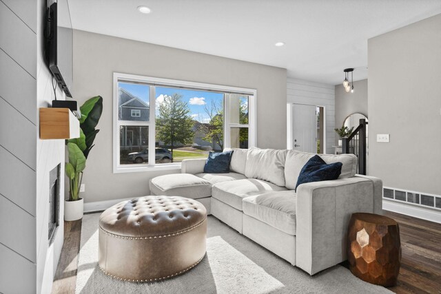 2908 Mark Twain Dr, Chaska, MN 55318 - living room featuring recessed lighting, wood finished floors, baseboards, and a fireplace