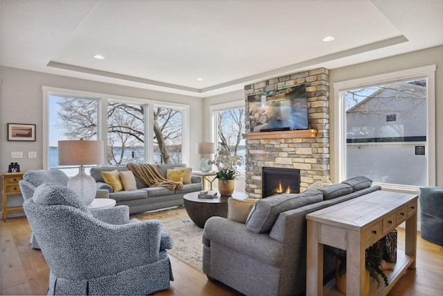 3100 Island View Dr, Mound, MN 55364 - living room with a tray ceiling, a fireplace, hardwood / wood-style floors, and recessed lighting