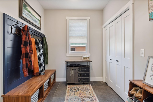 3100 Island View Dr, Mound, MN 55364 - mudroom with dark tile patterned flooring and baseboards