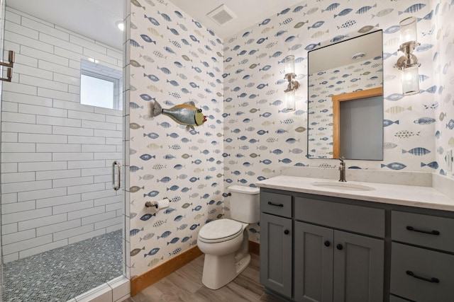3100 Island View Dr, Mound, MN 55364 - bathroom with wallpapered walls, a stall shower, toilet, wood finished floors, and vanity