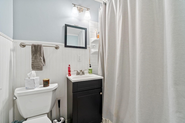 662 24th Ave NE, Minneapolis, MN 55418 - bathroom with a wainscoted wall, toilet, vanity, and a shower with curtain