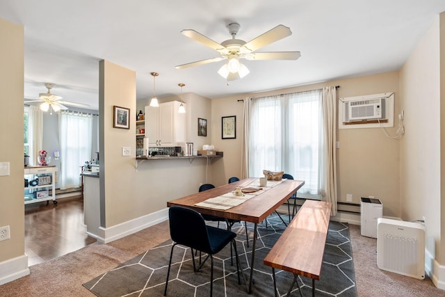 662 24th Ave NE, Minneapolis, MN 55418 - dining room with a ceiling fan, carpet flooring, baseboards, a wall mounted AC, and a baseboard heating unit