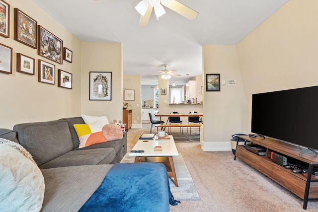 662 24th Ave NE, Minneapolis, MN 55418 - living room with a ceiling fan, light carpet, and baseboards