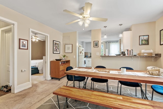 662 24th Ave NE, Minneapolis, MN 55418 - dining space with a ceiling fan, light carpet, and baseboards