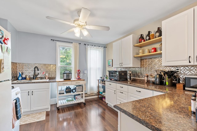 662 24th Ave NE, Minneapolis, MN 55418 - kitchen with open shelves, dark countertops, a sink, white cabinets, and ceiling fan