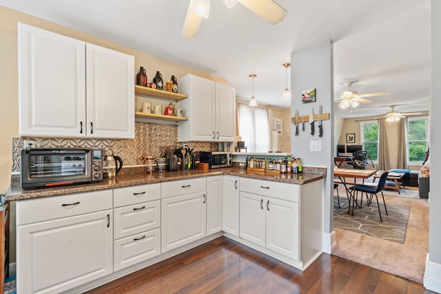 662 24th Ave NE, Minneapolis, MN 55418 - kitchen featuring ceiling fan, stainless steel microwave, dark wood finished floors, and backsplash