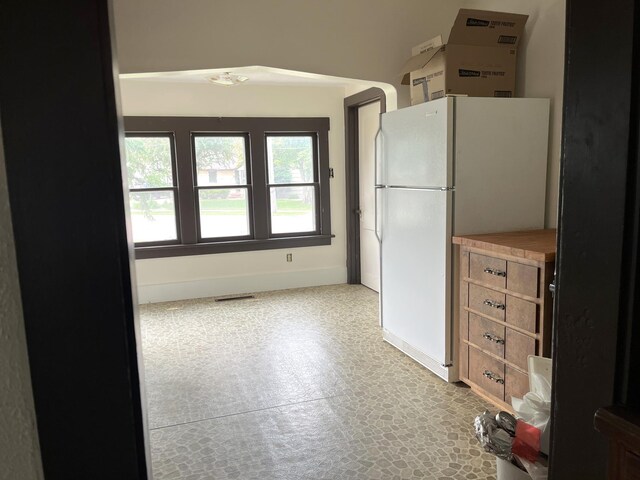 845 12th St, Windom, MN 56101 - kitchen featuring freestanding refrigerator and baseboards