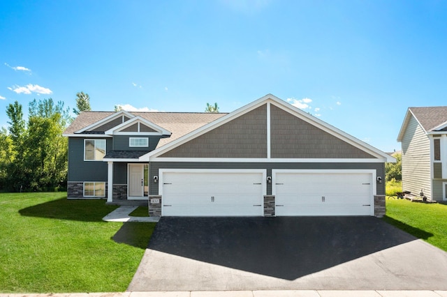 4375 31st St S, Saint Cloud, MN 56301 - craftsman house featuring stone siding, driveway, a front yard, and an attached garage