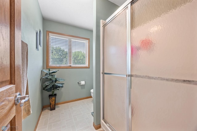 117 50th Ave E, Fargo, ND 58078 - bathroom with toilet and a stall shower