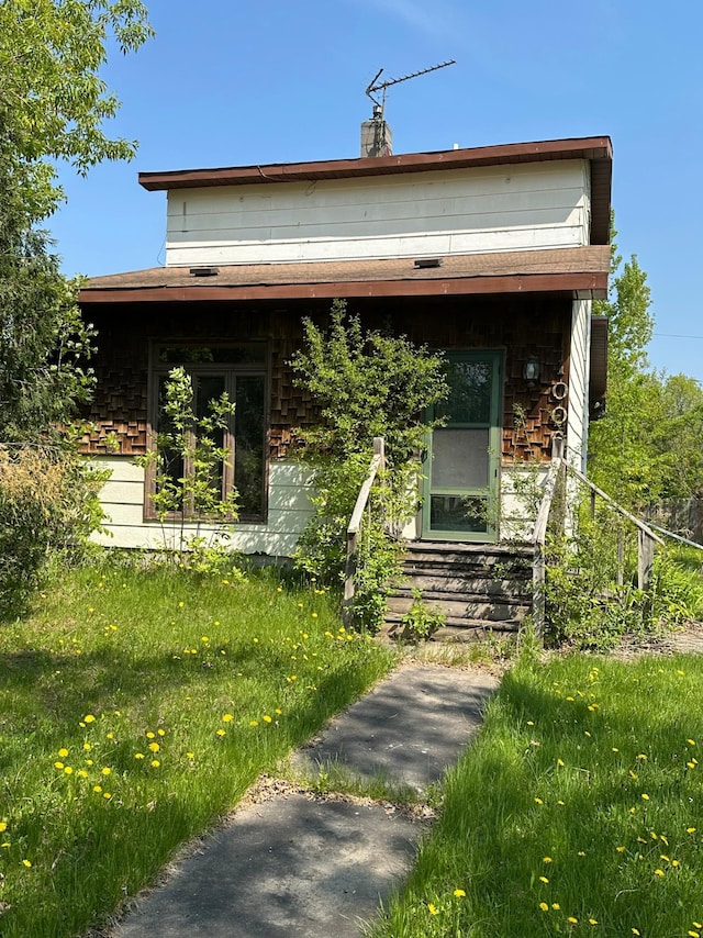 1004 9th St 1006, International Falls, MN 56649 - view of front of house with a chimney and entry steps