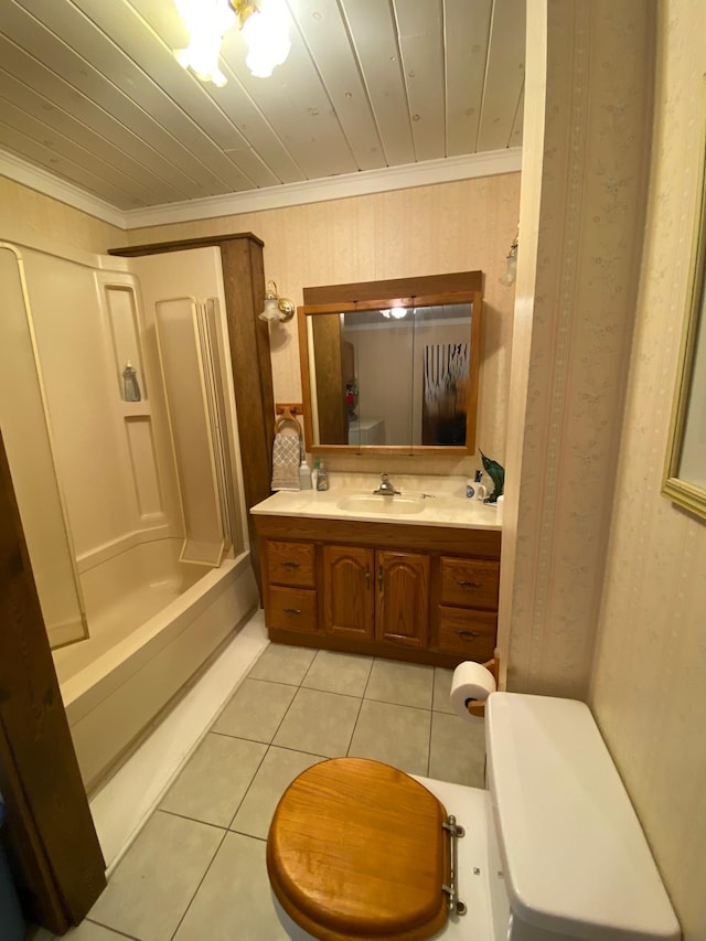 1004 9th St 1006, International Falls, MN 56649 - bathroom with toilet, tile patterned flooring, vanity, ornamental molding, and shower / washtub combination
