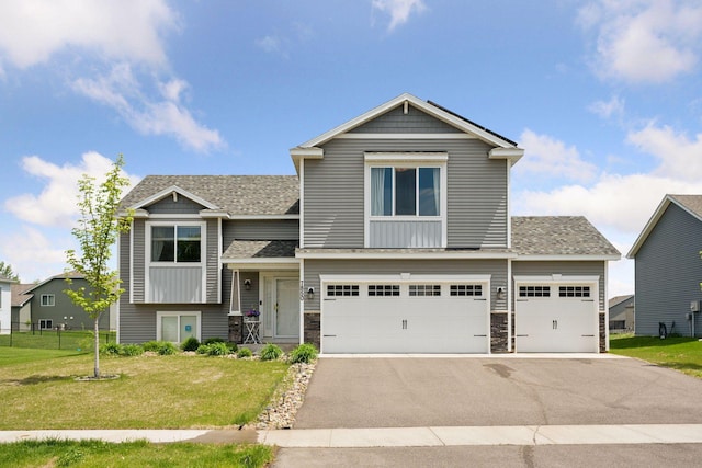 7850 Lachman Ave NE, Otsego, MN 55301 - view of front of property with driveway, a front lawn, an attached garage, and stone siding