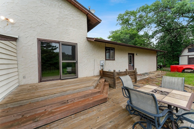 7567 Lent Trl, Lent Twp, MN 55079 - wooden terrace featuring outdoor dining area