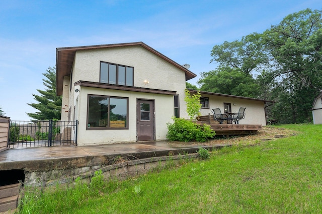 7567 Lent Trl, Lent Twp, MN 55079 - rear view of property with stucco siding, a patio area, and a yard