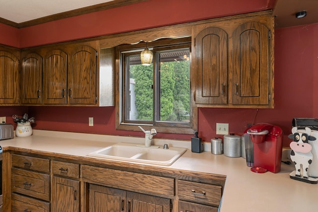 7567 Lent Trl, Lent Twp, MN 55079 - kitchen with light countertops, brown cabinets, and crown molding