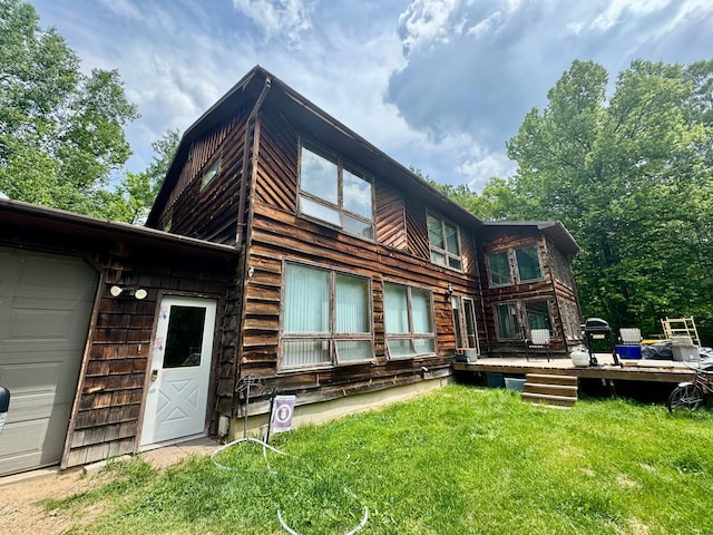 1831 State Highway 11 SE, Gudrid Twp, MN 56623 - back of house with a lawn and a wooden deck