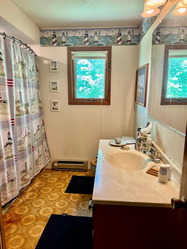 1831 State Highway 11 SE, Gudrid Twp, MN 56623 - bathroom featuring baseboard heating, vanity, and curtained shower