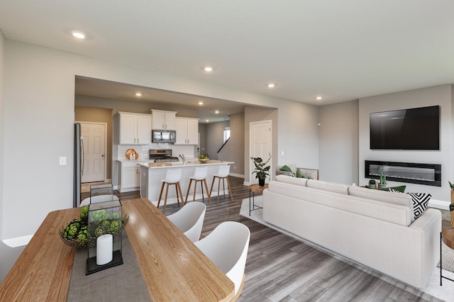 1549 143rd St E, Rosemount, MN 55068 - living room with dark wood-style floors, recessed lighting, and baseboards