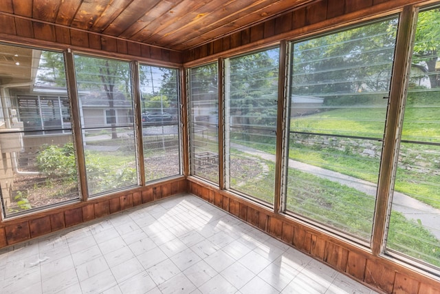 4922 Sheridan Ave S, Minneapolis, MN 55410 - unfurnished sunroom featuring wood ceiling, wood walls, and tile patterned flooring