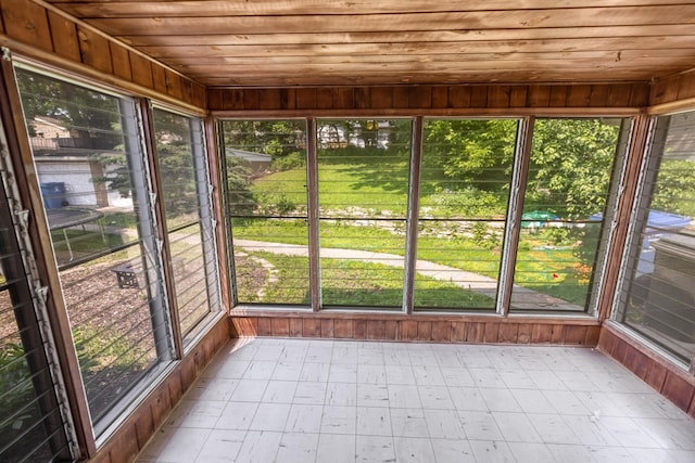 4922 Sheridan Ave S, Minneapolis, MN 55410 - unfurnished sunroom with wooden ceiling, healthy amount of natural light, and tile patterned floors