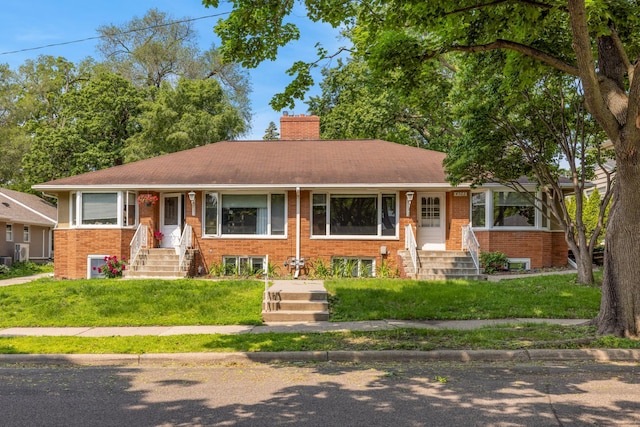 4922 Sheridan Ave S, Minneapolis, MN 55410 - ranch-style house featuring brick siding, a chimney, and entry steps